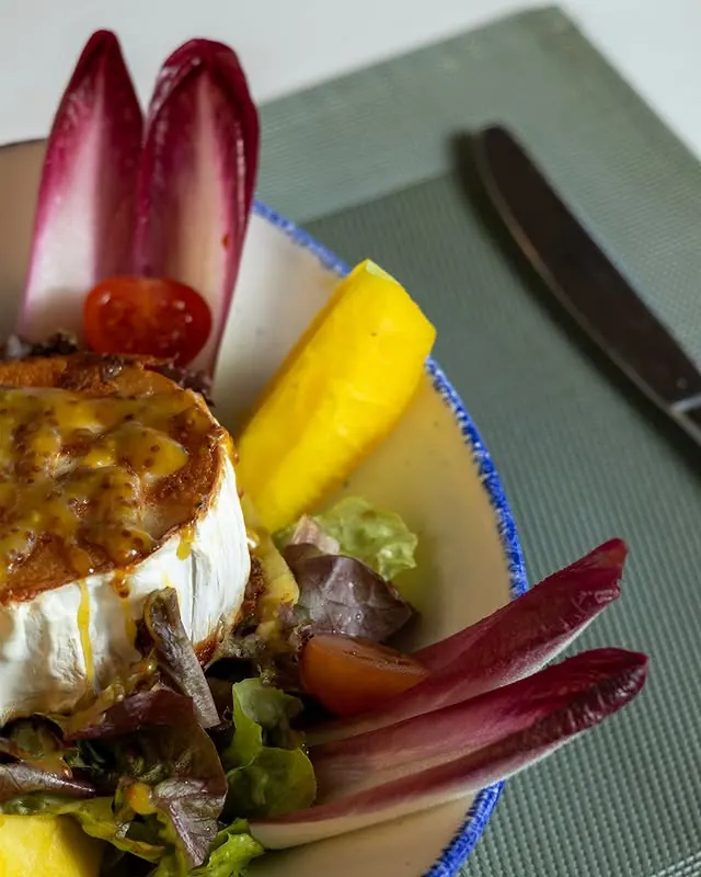 Goat cheese salad with pineapple, apple and endive