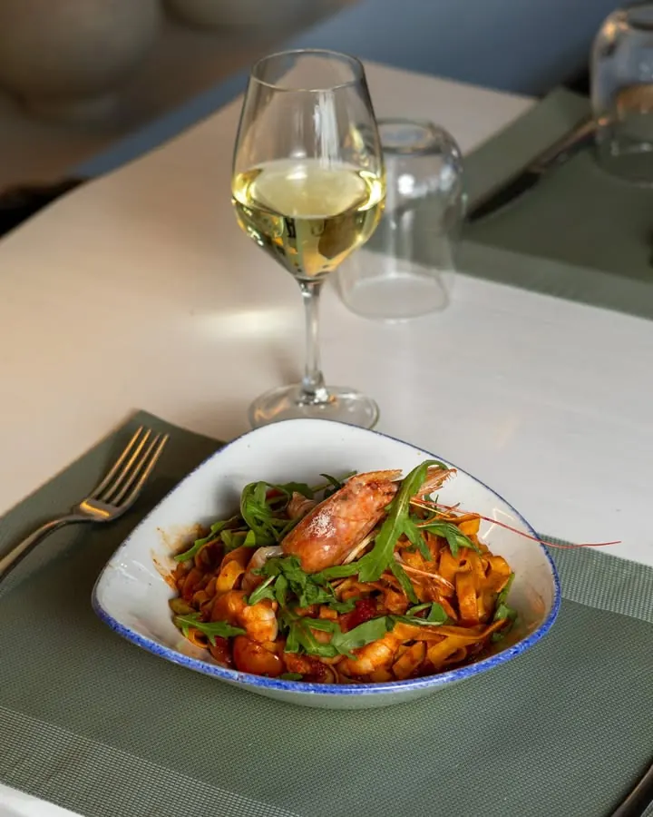 Tagliatelle with a glass of white wine