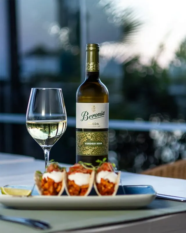 Tacos with a bottle of Beronia verdejo