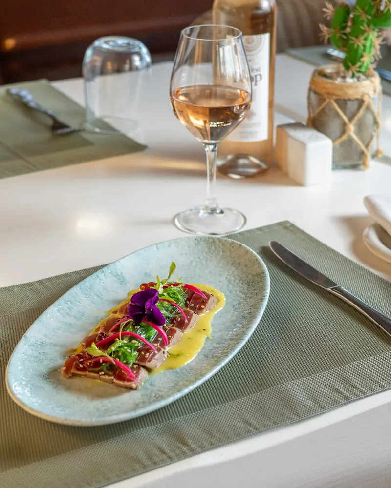 Tuna tataki with orange vinaigrette and a glass of rosé