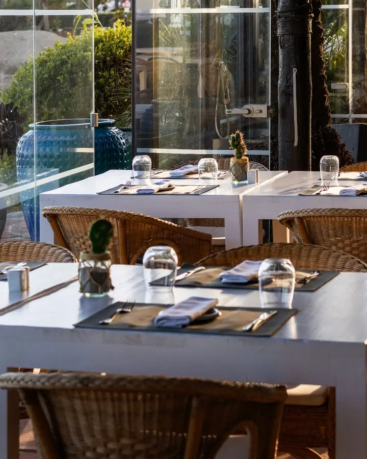 Terrace tables at Las Cuchis in the evening light