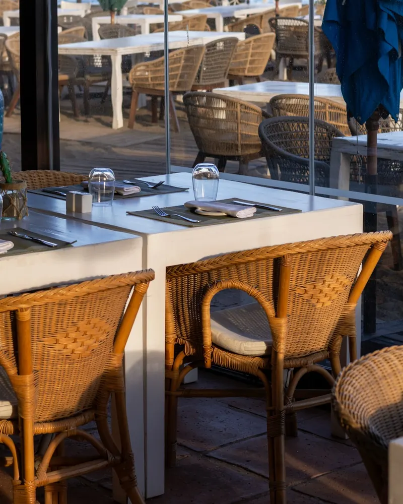 Rattan chairs on the glazed terrace